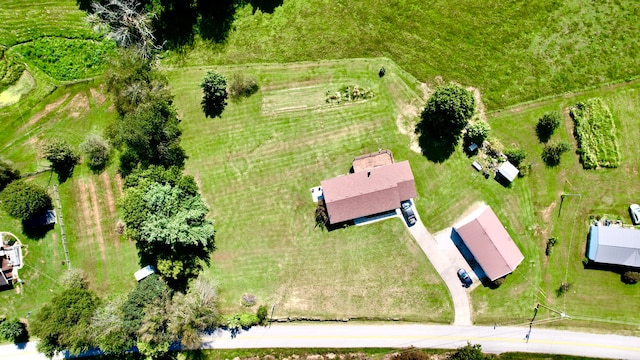 birds eye view of property with a rural view