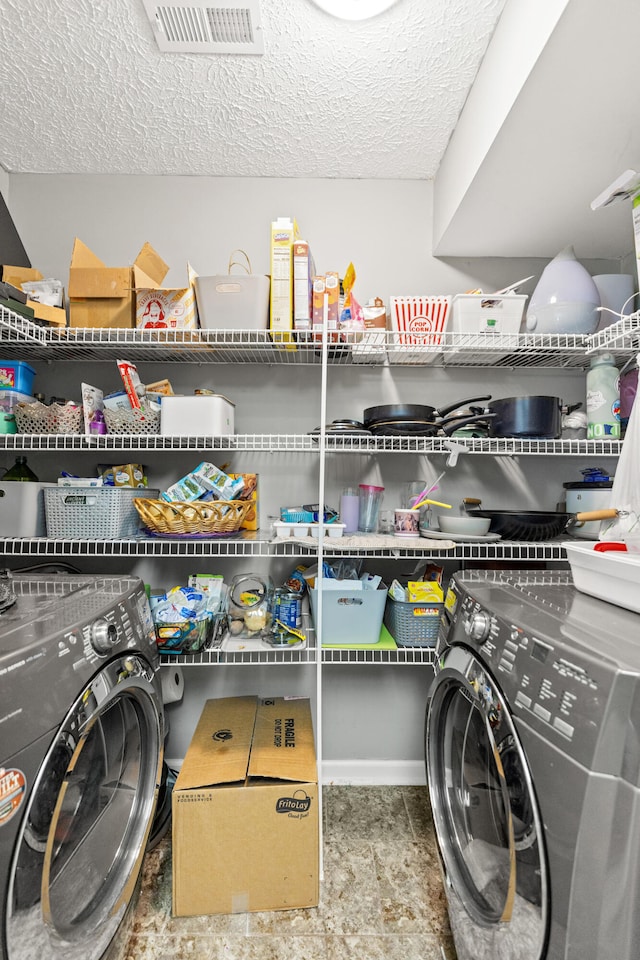 pantry with washing machine and dryer