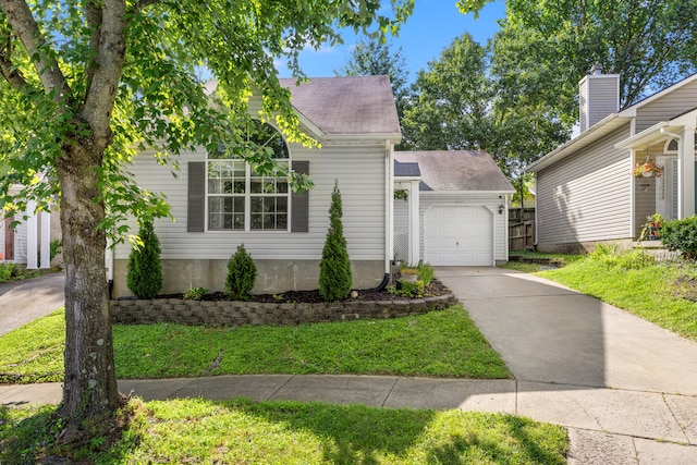 view of front of home featuring a garage and a front lawn