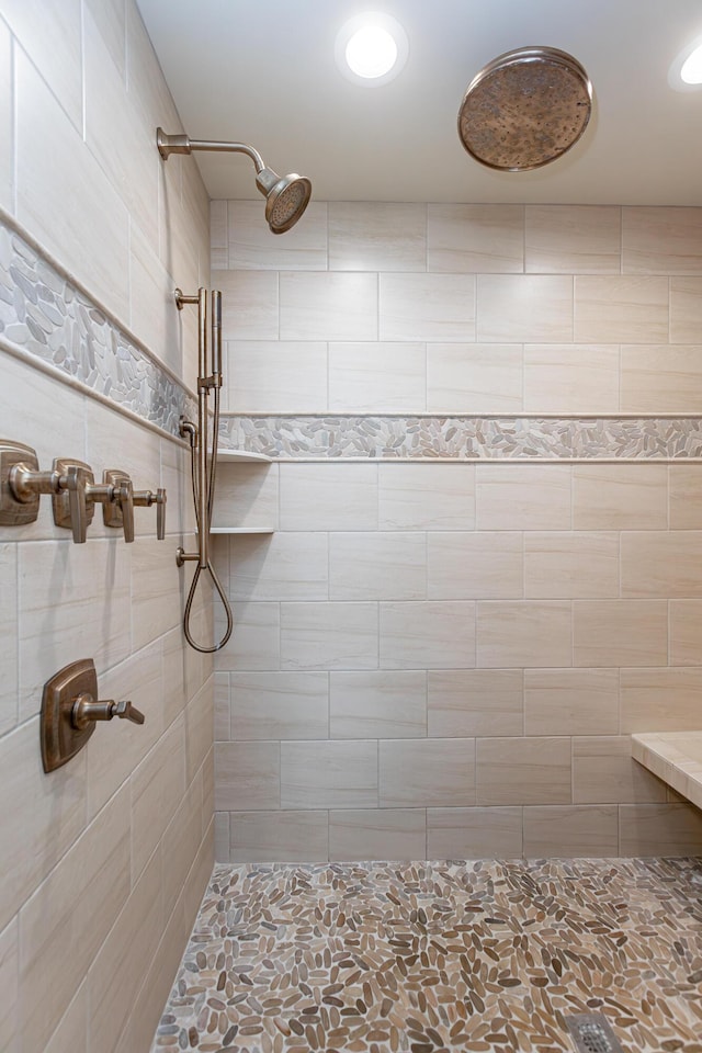 bathroom with a tile shower