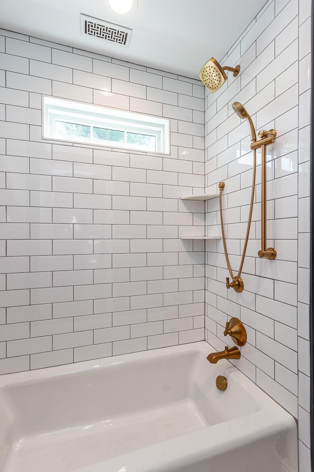 full bath featuring visible vents and shower / tub combination