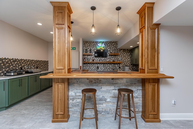 bar featuring baseboards, decorative backsplash, ornate columns, indoor wet bar, and recessed lighting