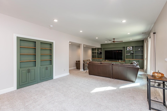 living area with recessed lighting, baseboards, a ceiling fan, and light colored carpet