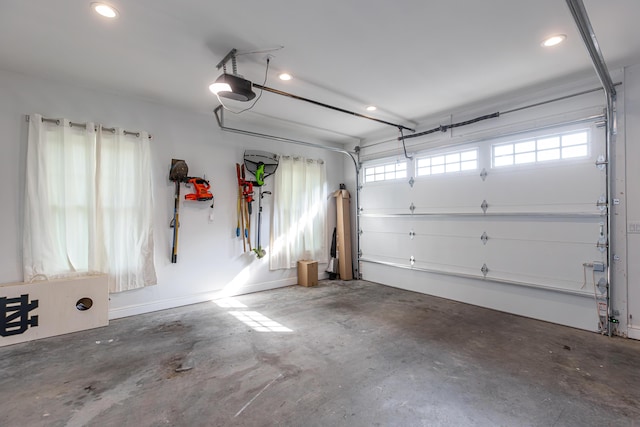 garage featuring a garage door opener and recessed lighting