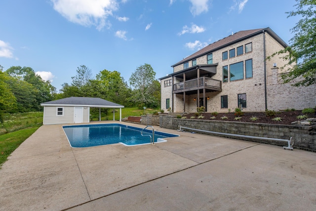 view of swimming pool featuring a fenced in pool, a patio area, an outdoor structure, and a storage structure