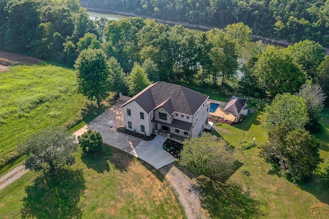 drone / aerial view featuring a forest view