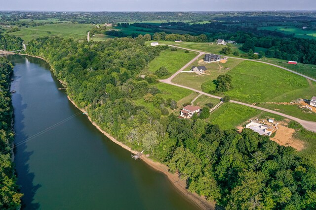 bird's eye view featuring a water view and a wooded view