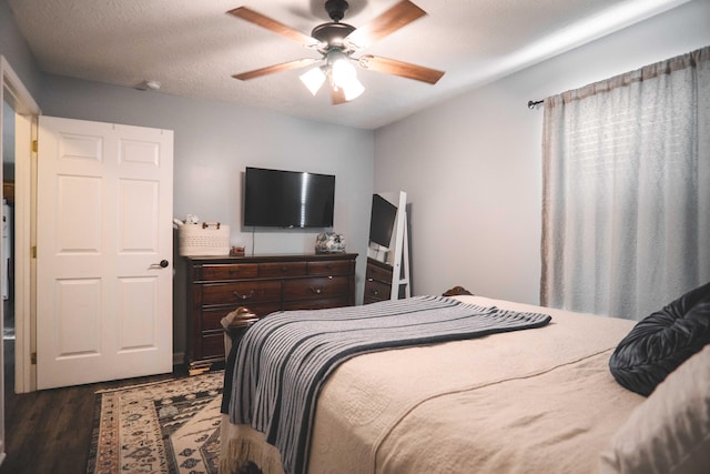 bedroom featuring ceiling fan, a textured ceiling, and hardwood / wood-style floors