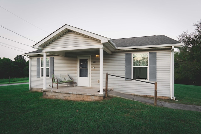 ranch-style home featuring a front yard