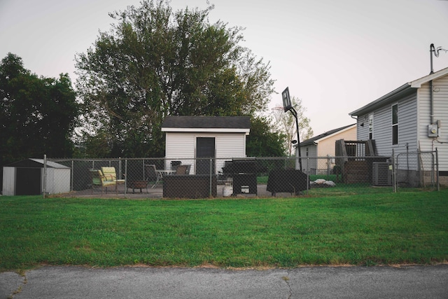 exterior space with a storage shed and a lawn