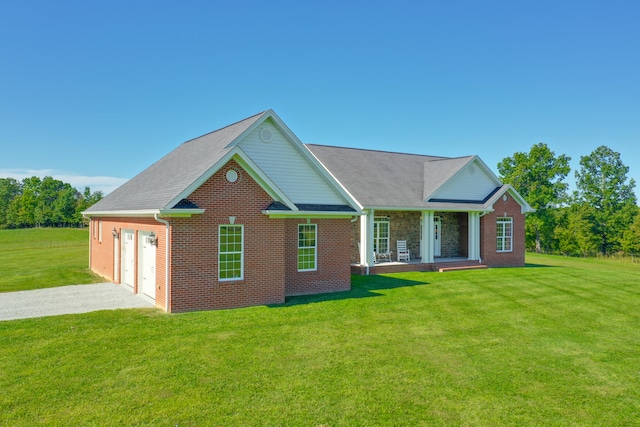 view of front facade featuring covered porch, a garage, and a front lawn