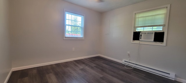 unfurnished room featuring dark hardwood / wood-style floors, cooling unit, and baseboard heating