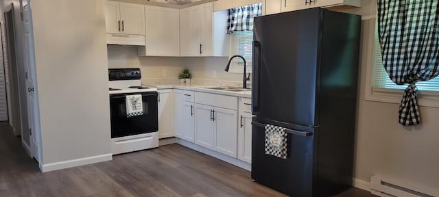 kitchen featuring baseboard heating, hardwood / wood-style floors, electric stove, black refrigerator, and white cabinets