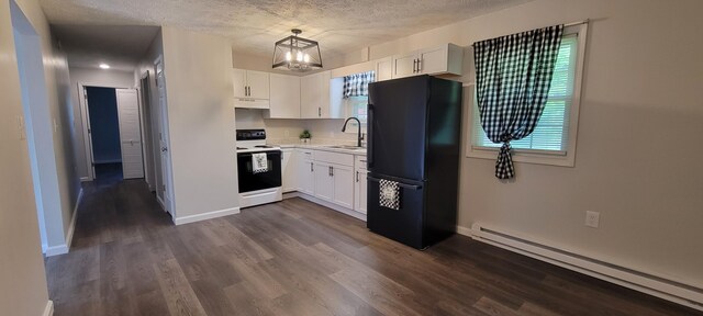 kitchen with hanging light fixtures, a baseboard radiator, white range with electric cooktop, black refrigerator, and white cabinets