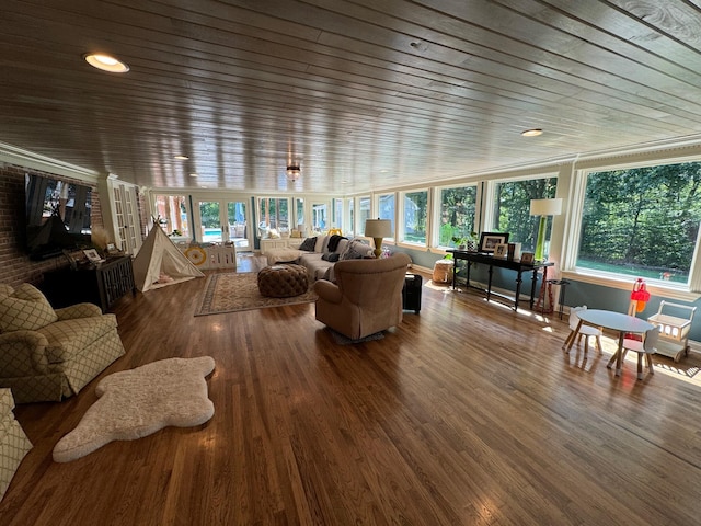 living room featuring plenty of natural light, hardwood / wood-style floors, and wooden ceiling