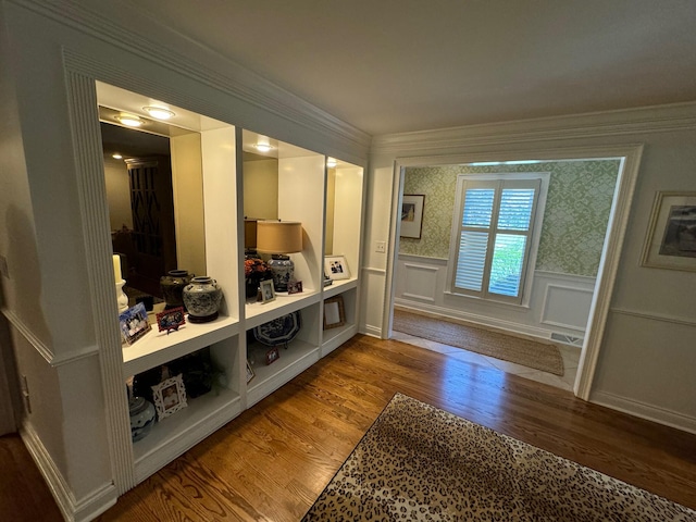 mudroom with hardwood / wood-style flooring and crown molding