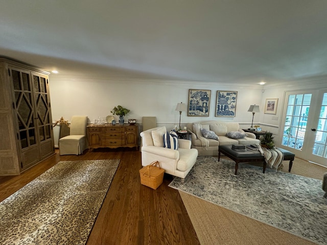 living room with crown molding and dark hardwood / wood-style floors