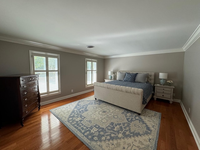 bedroom featuring crown molding and hardwood / wood-style floors