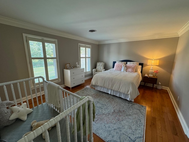 bedroom featuring hardwood / wood-style flooring and ornamental molding