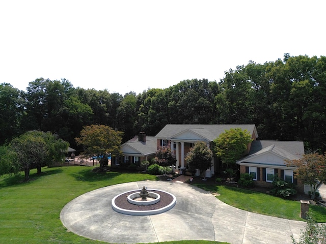 view of front of property with a patio area and a front yard