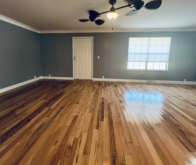 unfurnished room with crown molding, hardwood / wood-style floors, and ceiling fan