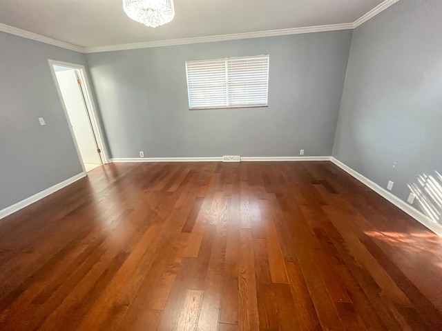 unfurnished room with ornamental molding and hardwood / wood-style floors