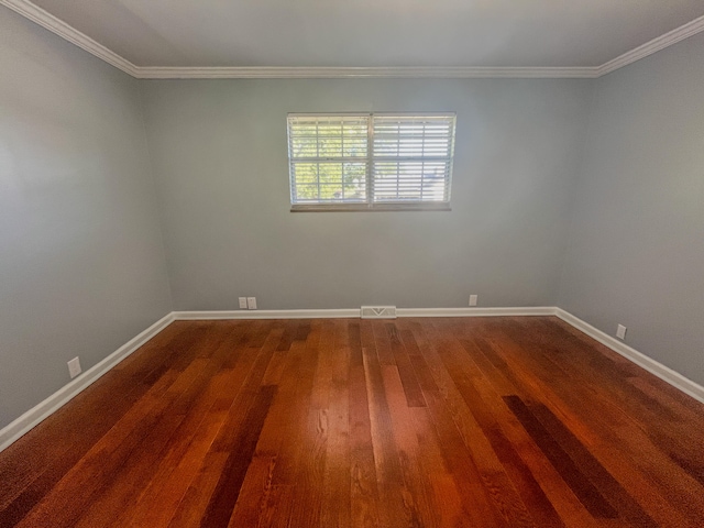 unfurnished room featuring crown molding and hardwood / wood-style floors