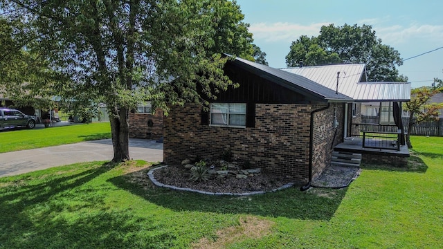 view of home's exterior with a yard