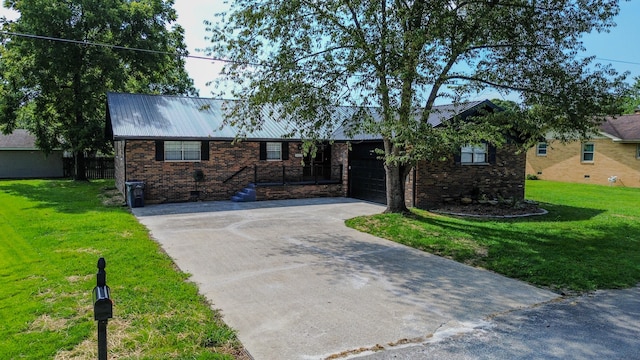 single story home featuring a garage and a front lawn