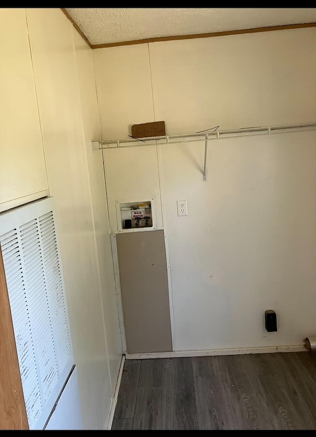 clothes washing area featuring dark hardwood / wood-style flooring and hookup for a washing machine