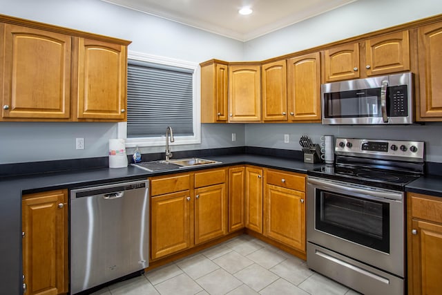 kitchen featuring sink, ornamental molding, and stainless steel appliances