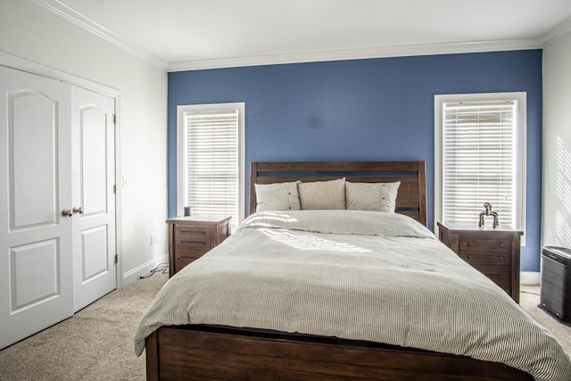 carpeted bedroom with ornamental molding