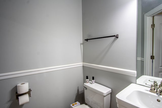 bathroom with sink and toilet