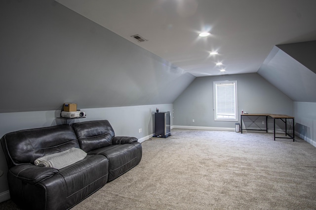 carpeted cinema with vaulted ceiling