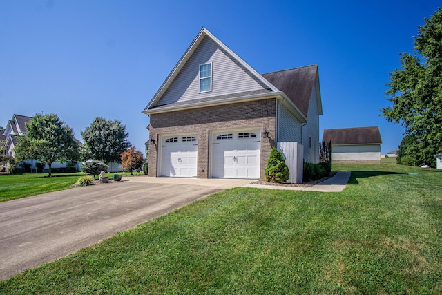 view of side of home featuring a yard and a garage