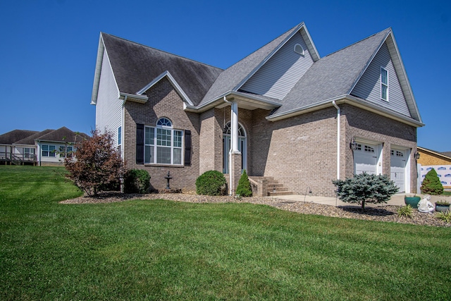 view of front of home featuring a garage and a front yard