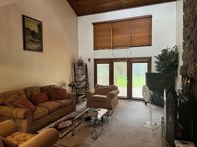 carpeted living area featuring high vaulted ceiling and wood ceiling