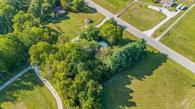 birds eye view of property with a rural view