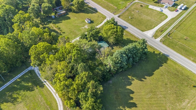 birds eye view of property with a rural view