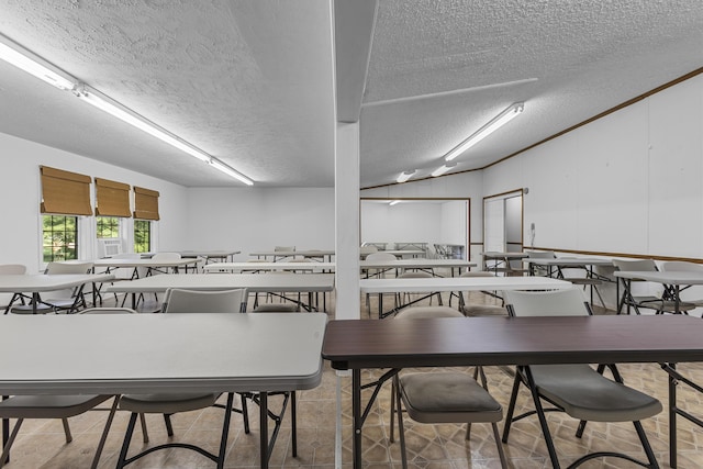 dining area featuring a textured ceiling