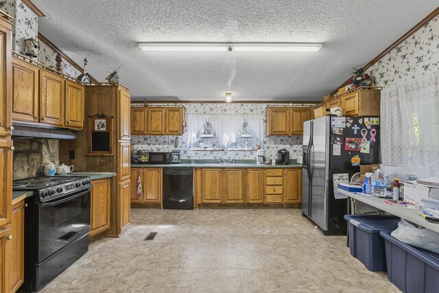 kitchen with plenty of natural light, black appliances, ornamental molding, and light tile patterned floors