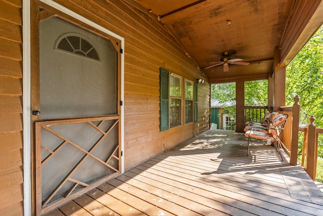 wooden deck featuring ceiling fan