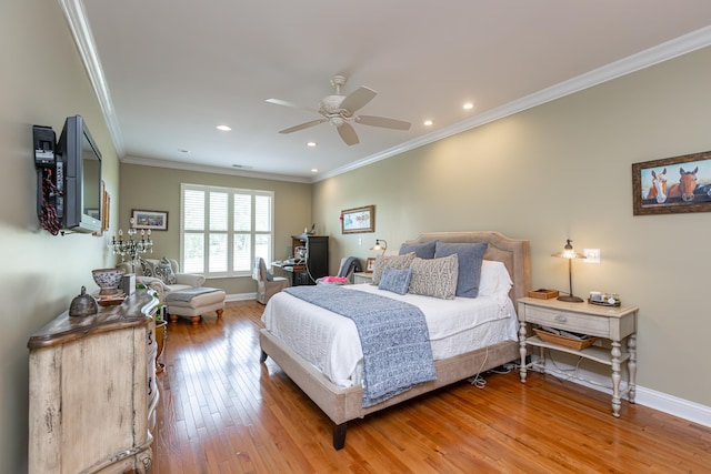 bedroom featuring ceiling fan, hardwood / wood-style flooring, and crown molding