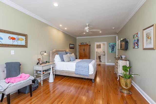 bedroom with hardwood / wood-style floors, ceiling fan, and crown molding