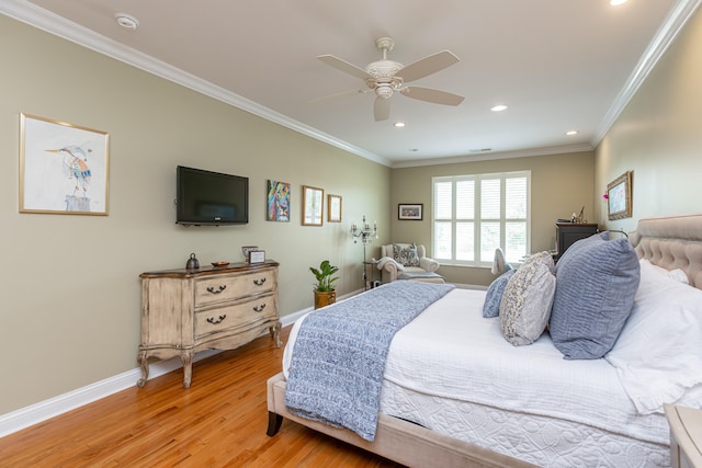 bedroom with ceiling fan, light hardwood / wood-style floors, and crown molding