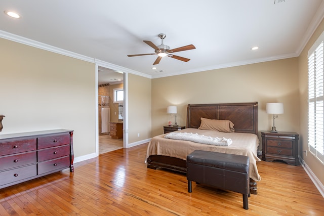 bedroom featuring light wood-type flooring, ceiling fan, connected bathroom, and ornamental molding