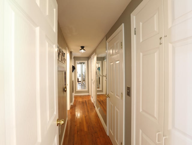 hallway with wood-type flooring