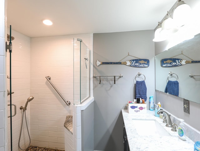 bathroom with vanity and walk in shower