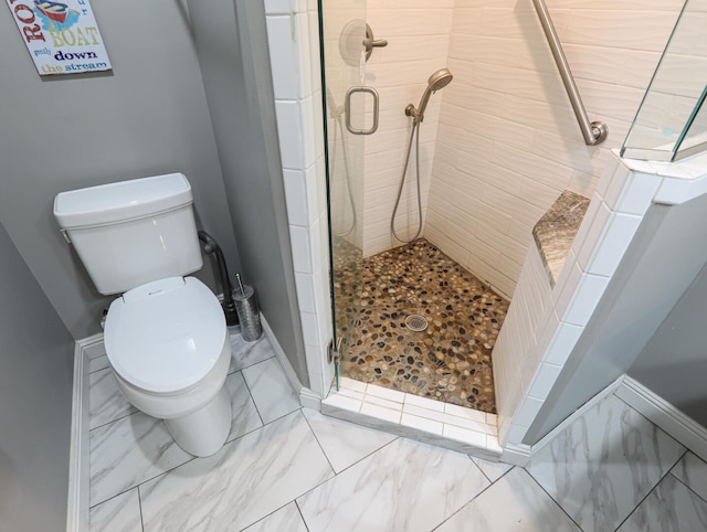 bathroom featuring toilet, walk in shower, and tile patterned floors