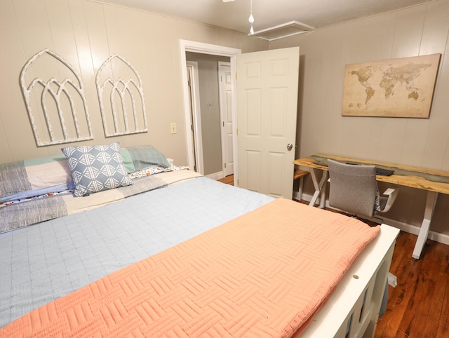 bedroom with dark hardwood / wood-style flooring